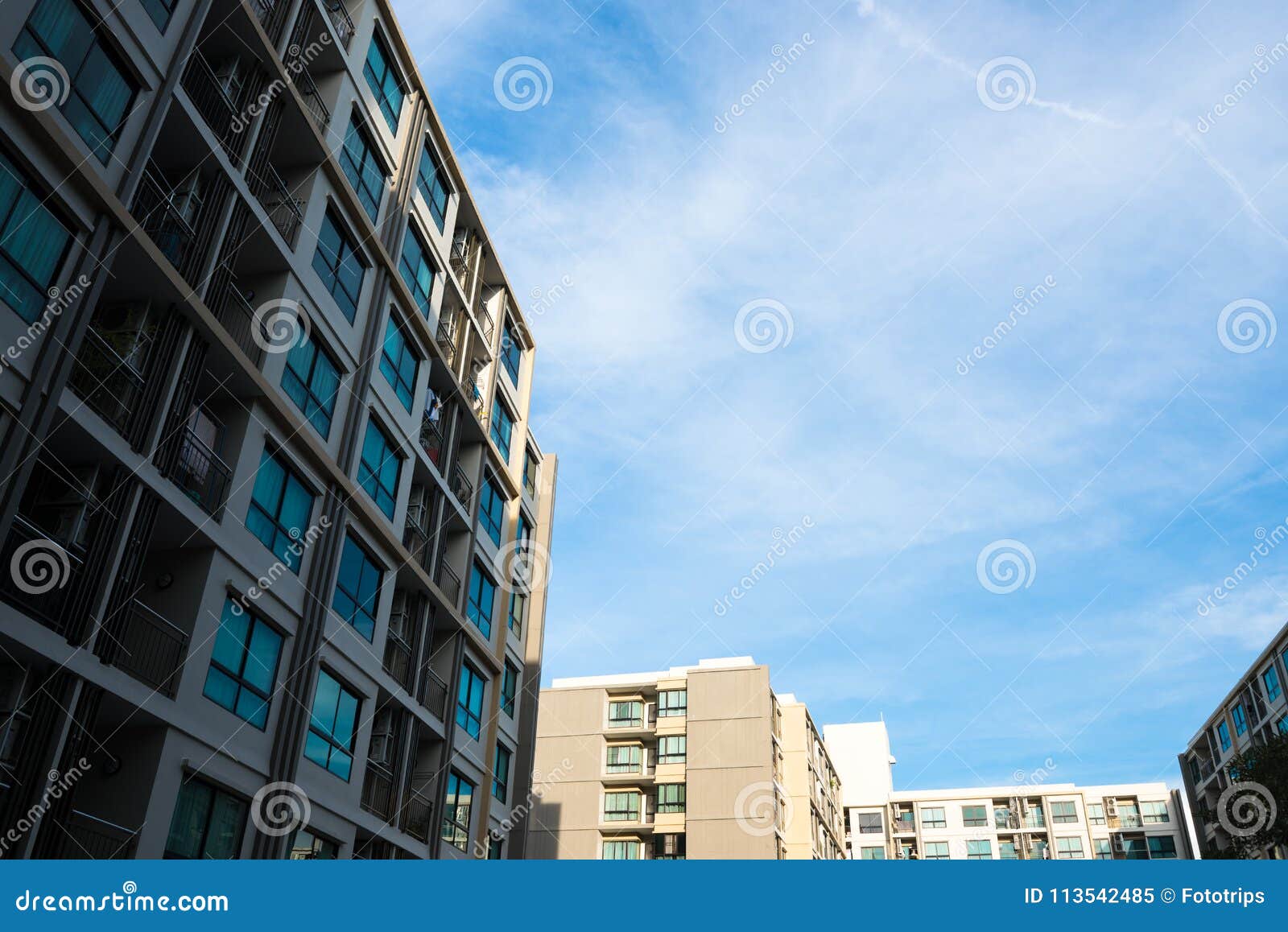 Image of Condo Building and Blue Sky Background. Stock Image Image of