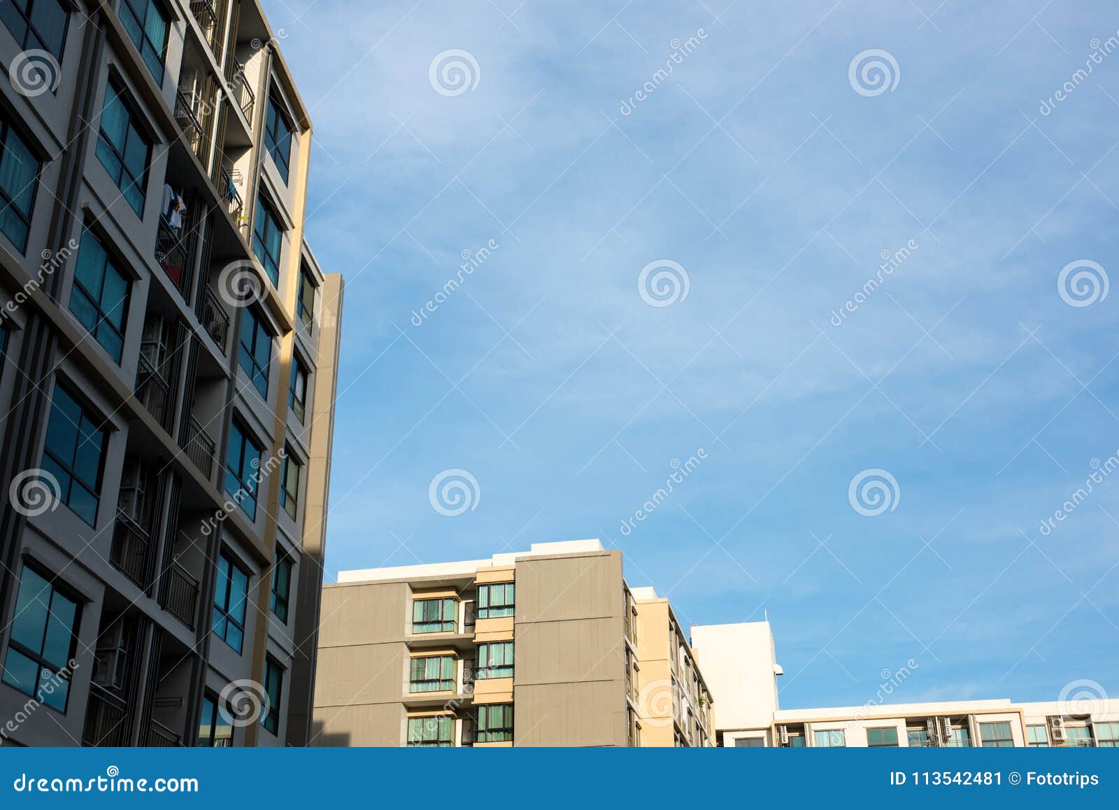 Image of Condo Building and Blue Sky Background. Stock Image Image of