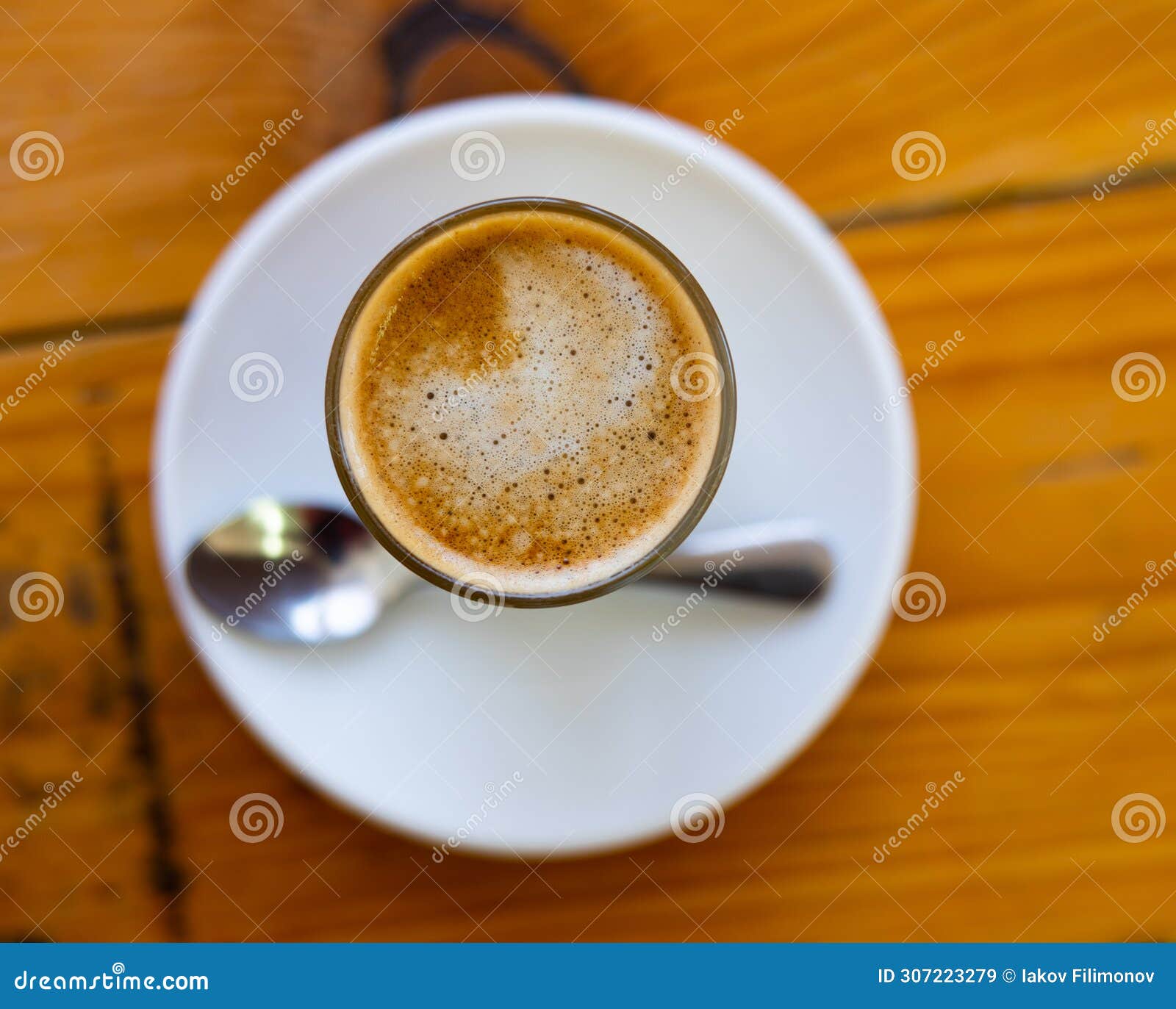 image of cup of fresh coffee cortado on table