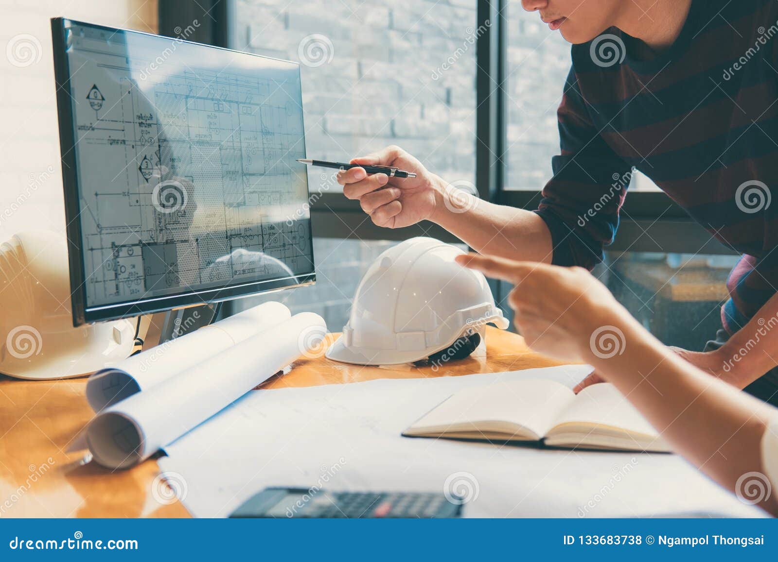 Image of Engineer or Architect Partner Meeting for Working with Stock