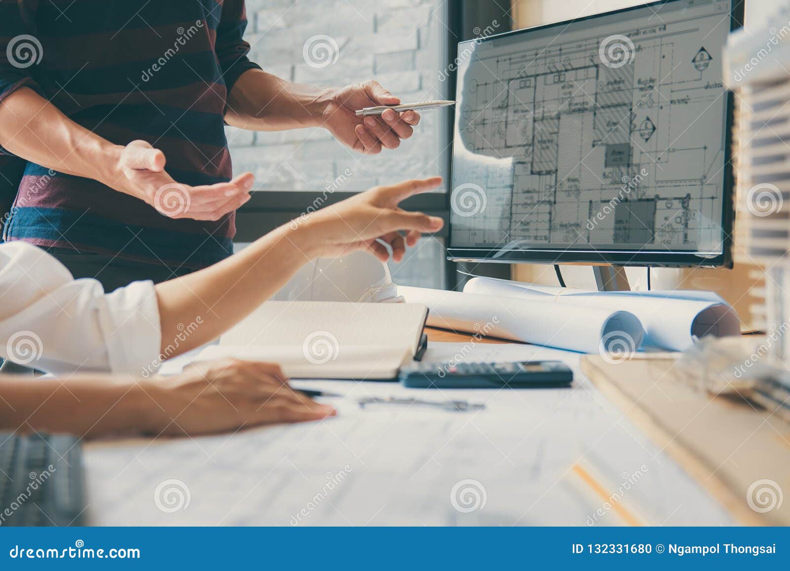 Image of Engineer or Architect Partner Meeting for Working with Stock