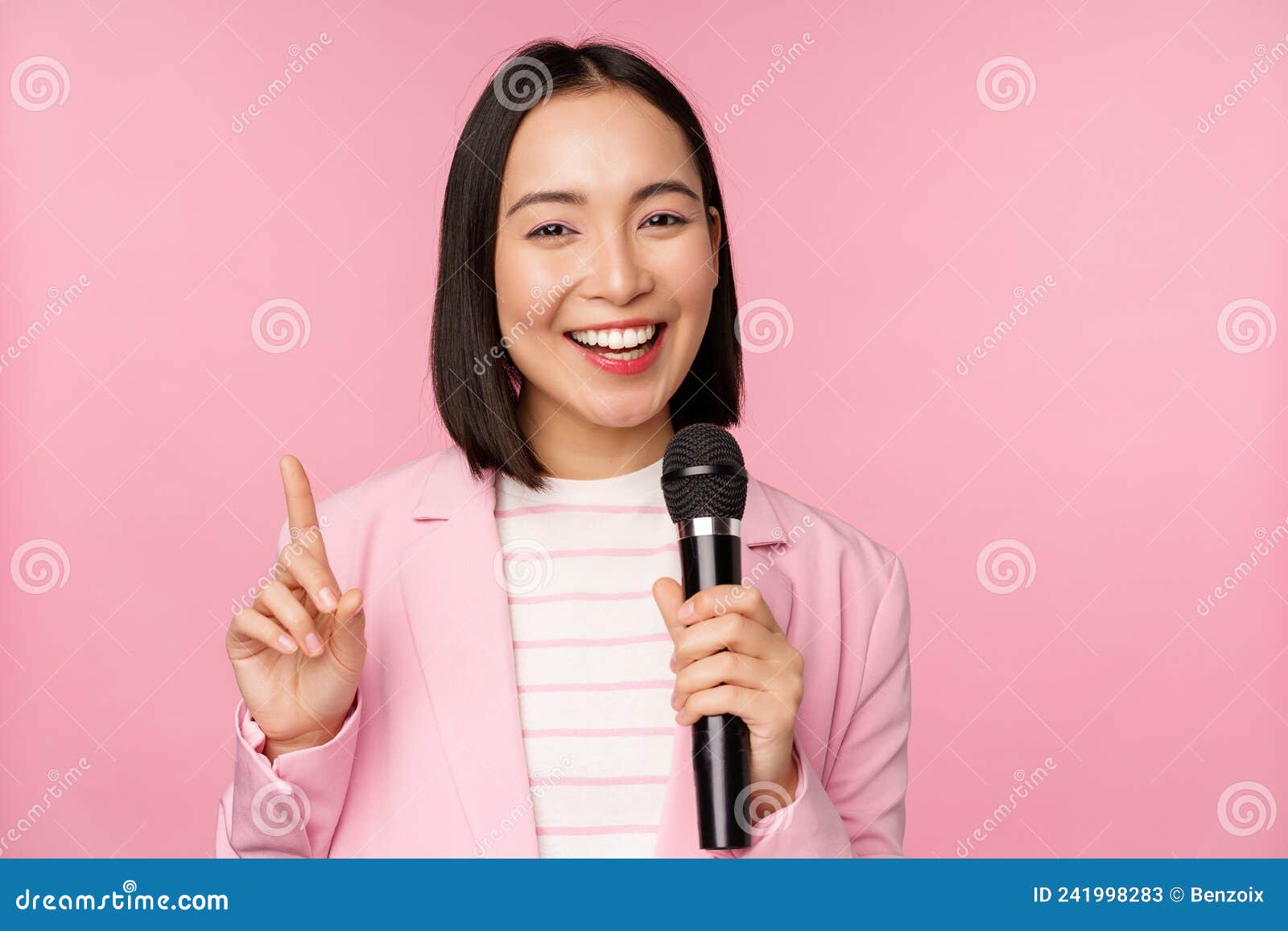 Image Of Enthusiastic Asian Businesswoman Giving Speech Talking With Microphone Holding Mic