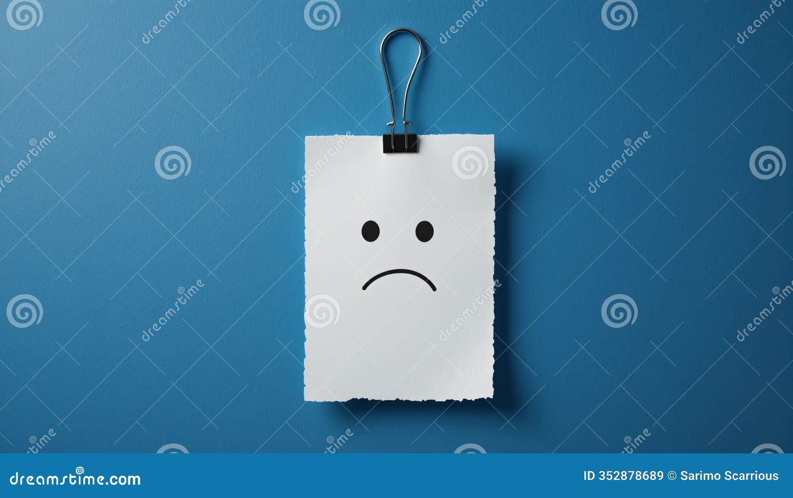simple sad face  on paper