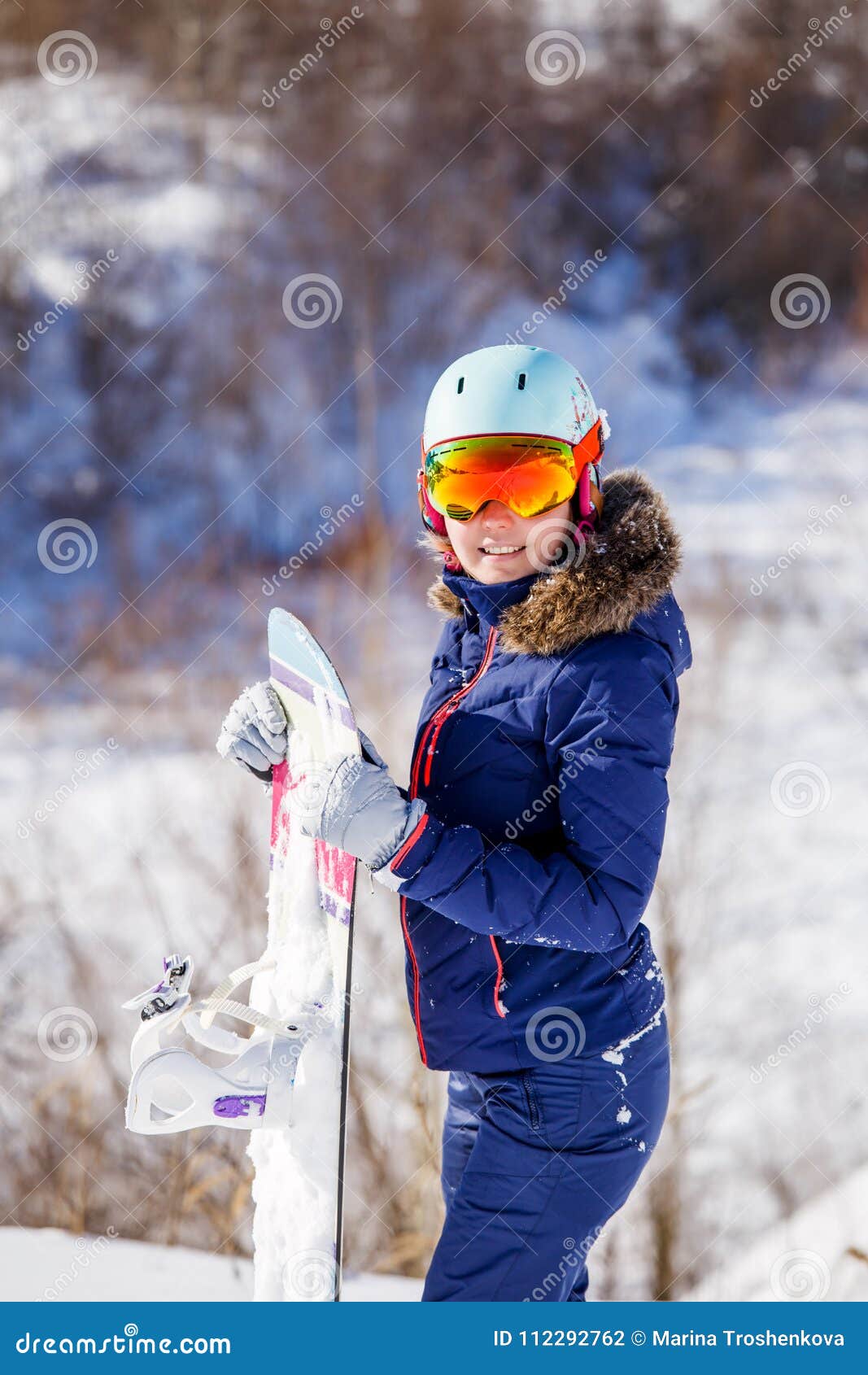 Image of Female Athlete Wearing Helmet with Snowboard Standing in Park ...