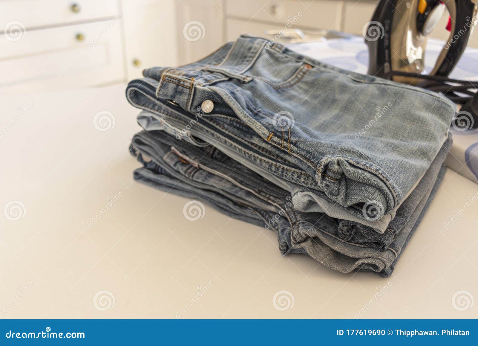 Image of Housework for Ironing Blue Jeans. Stock Photo Image of