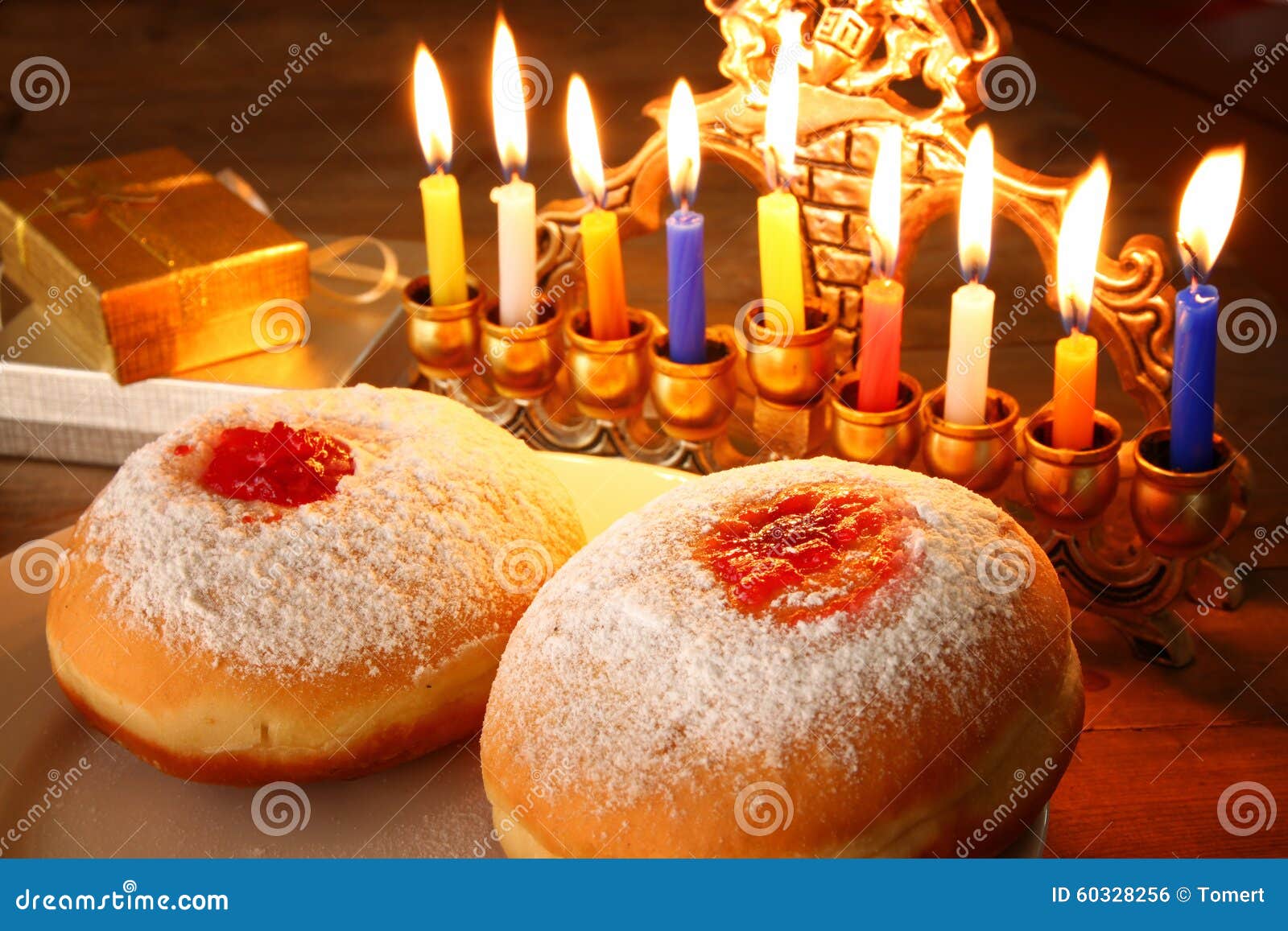 Menorah A Traditional Jewish Holiday Lighting The First Candle On A Hanukkahof A Burning