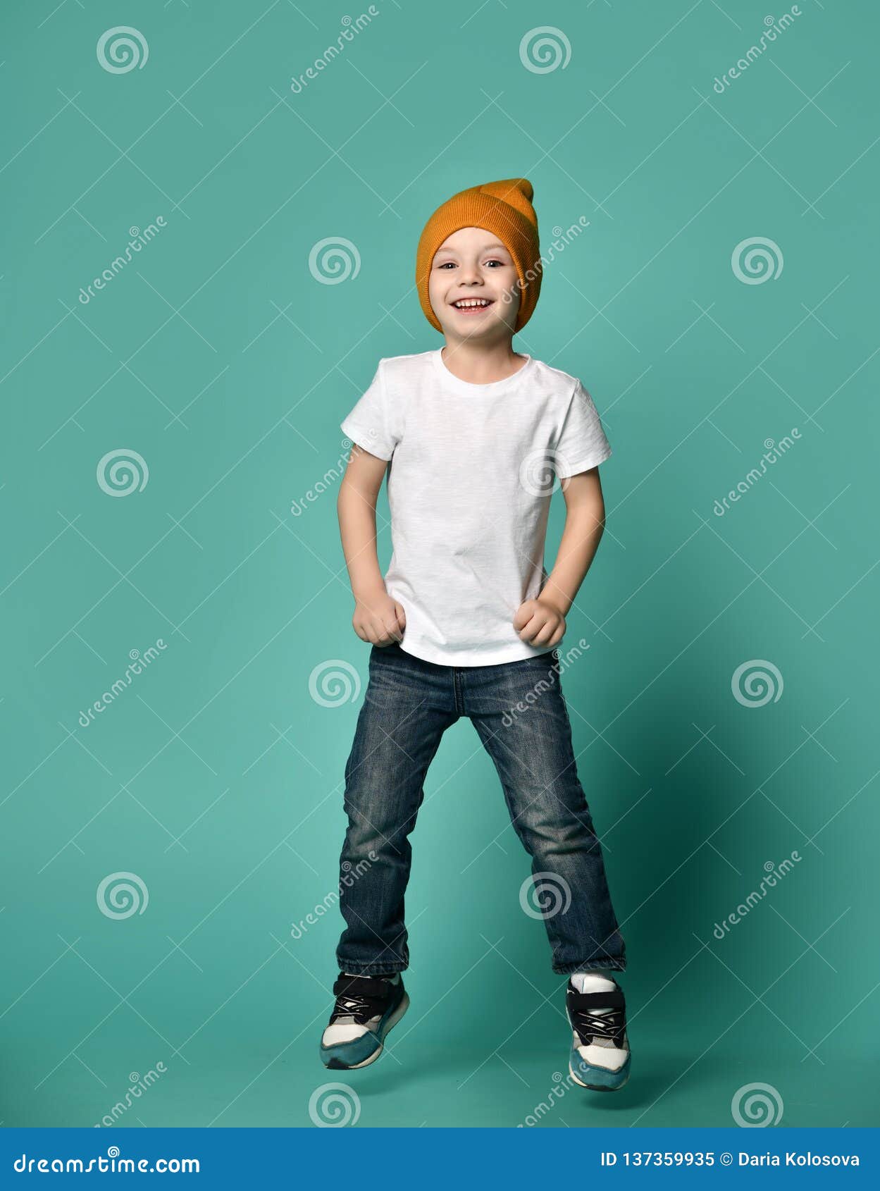 Image of Little Boy Child Jumping Over Green Background. Stock Image ...