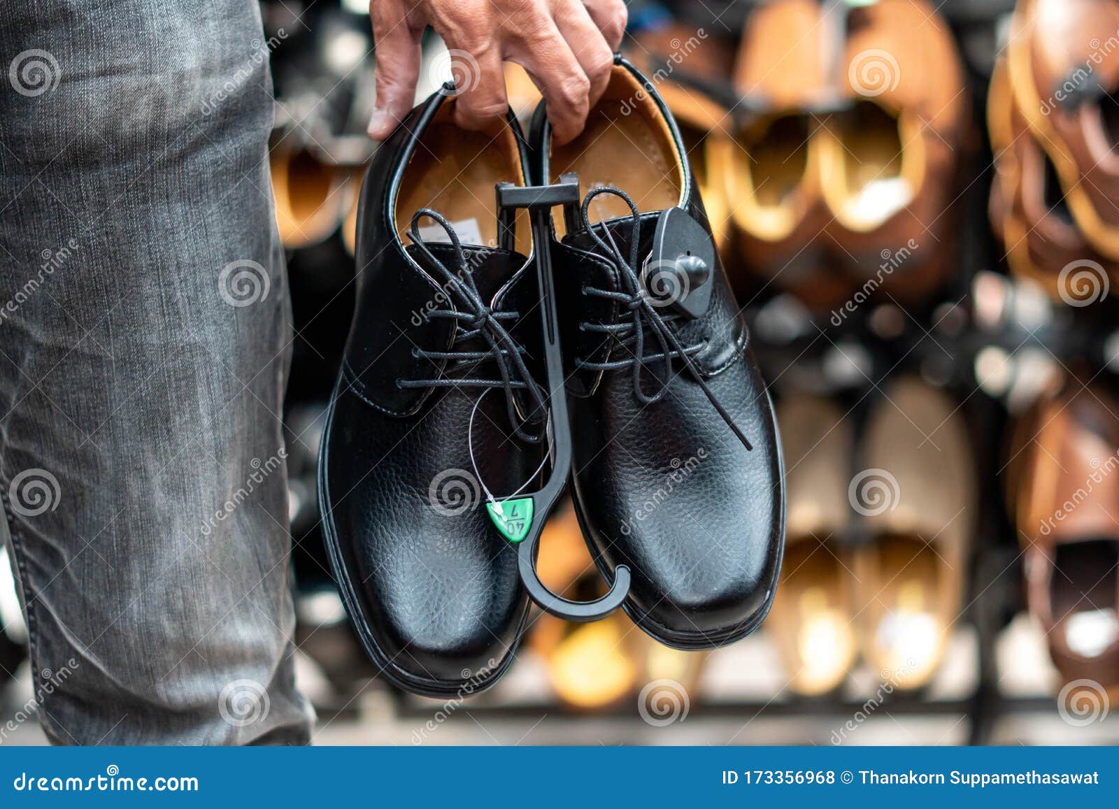 Image of Man Carrying Beautiful Couple Choosing Classic Shoes while ...