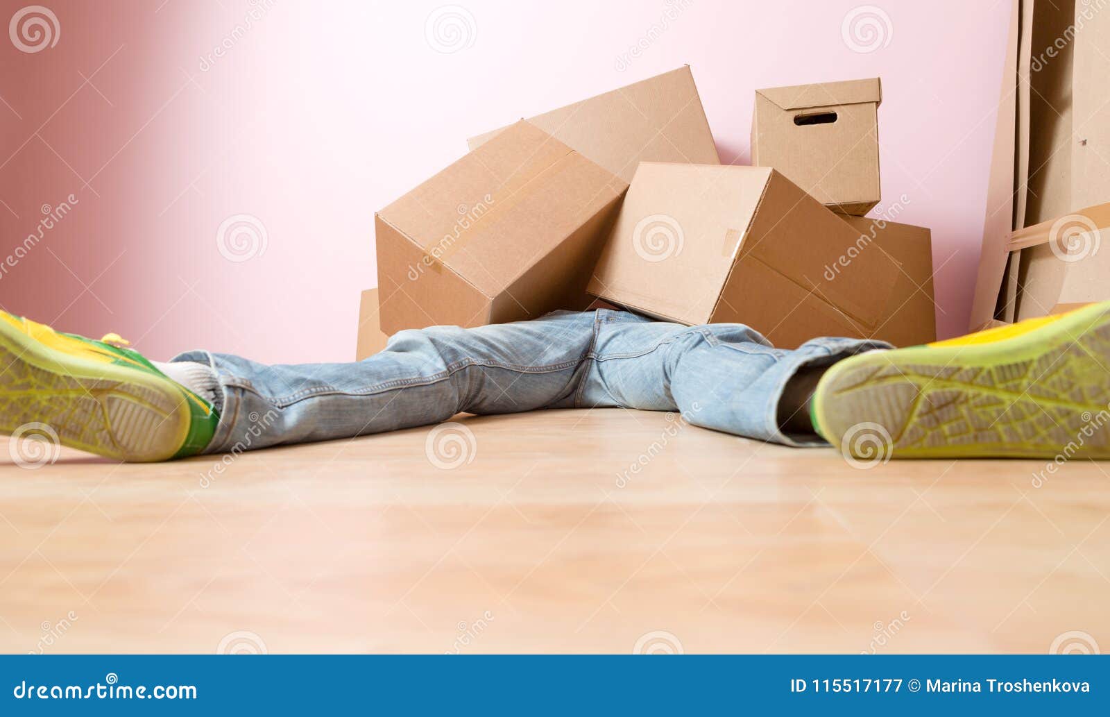 Image of Man in Jeans Lying Under Cardboard Boxes Stock Image Image of open, house 115517177