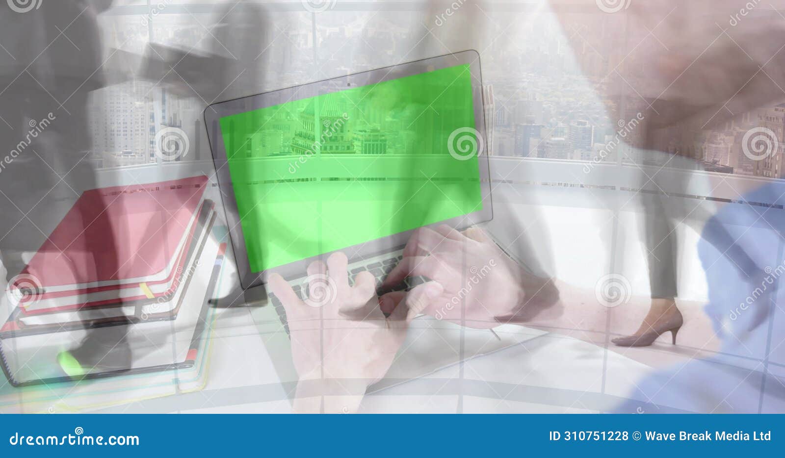 image of man using laptop with green screen over sped up commuters walking in modern building
