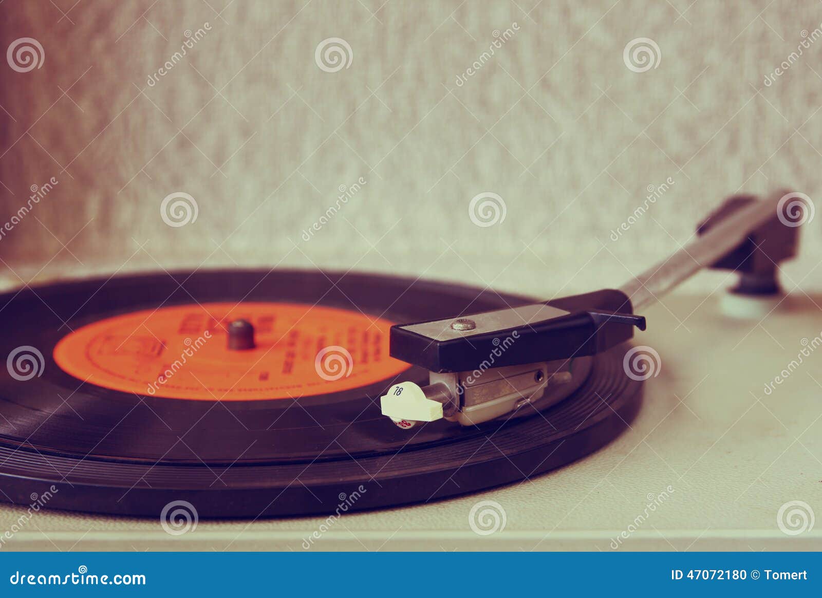 image of old record player, image is retro filtered . selective focus