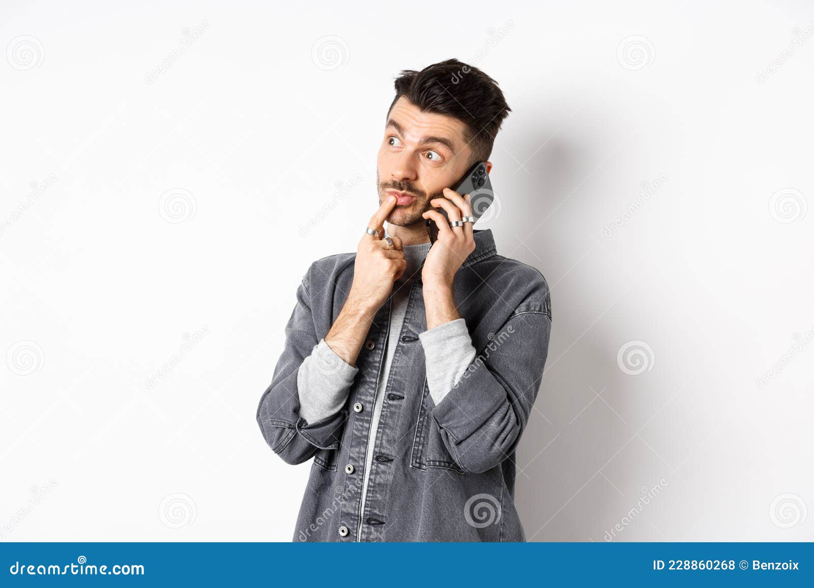 Image of Pensive Handsome Man Talking on Phone and Thinking, Making ...