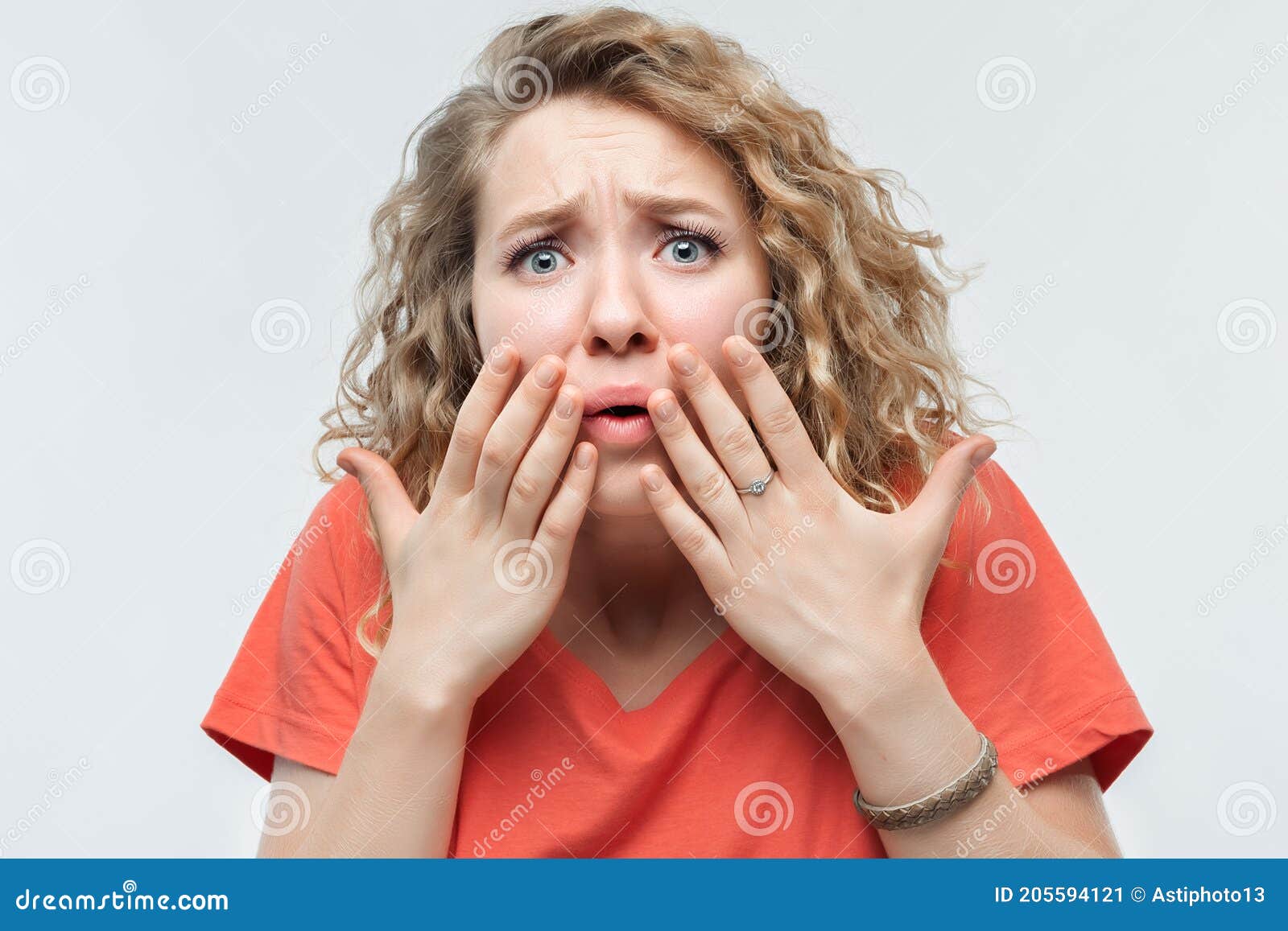 Image Of Scared Blonde Girl Covering Her Mouth With Hands Fright Phobia And Facial Expression