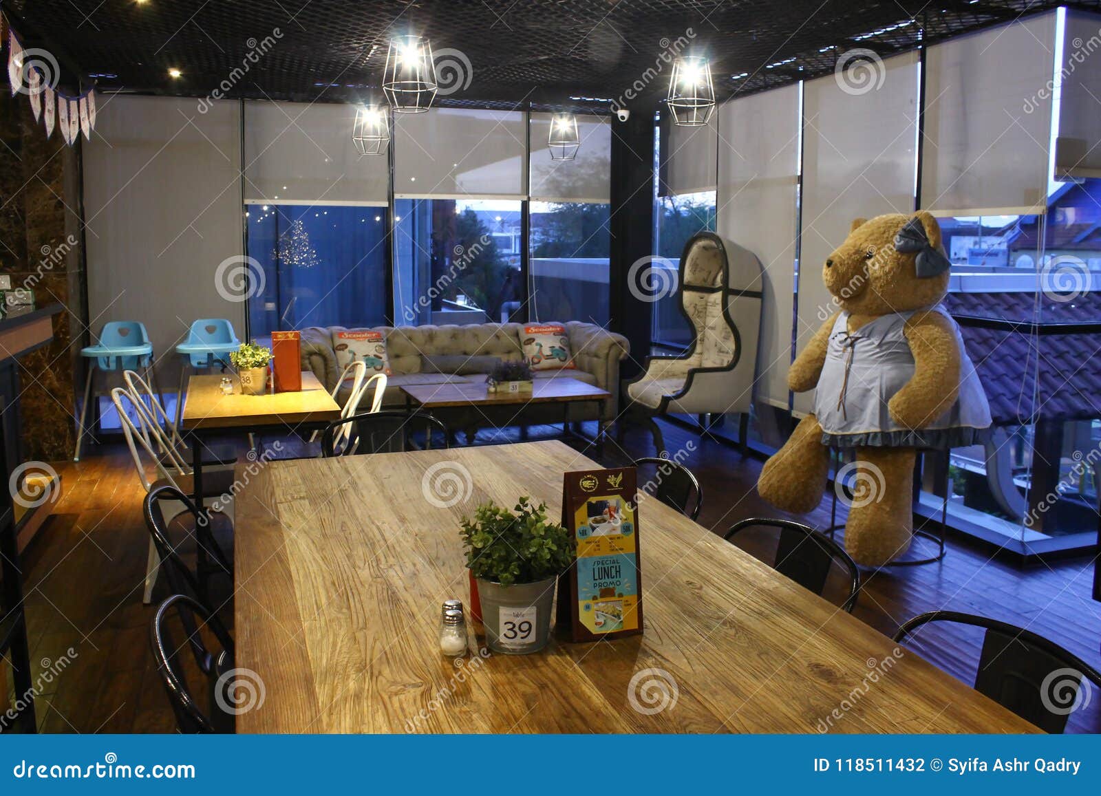 interior in cafe with huge bear