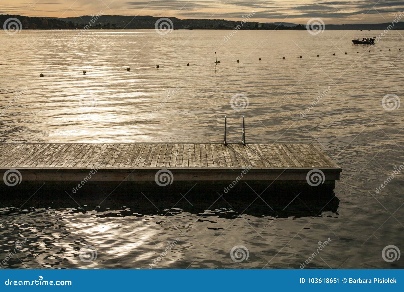 oslo-fjord, golden waters of the fjord and a boat.