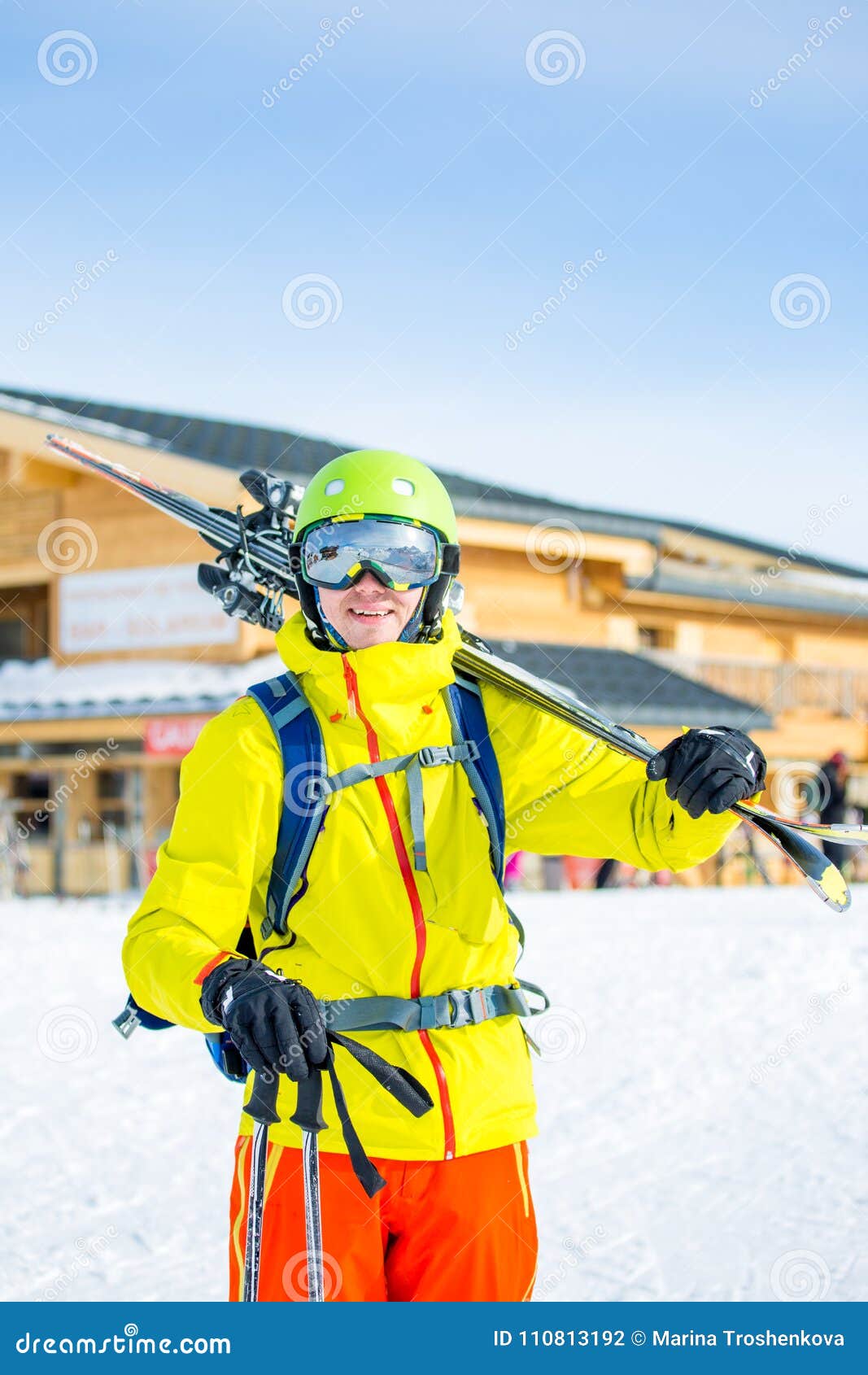 Image of Sportive Man in Helmet with Skis on His Shoulder Against ...