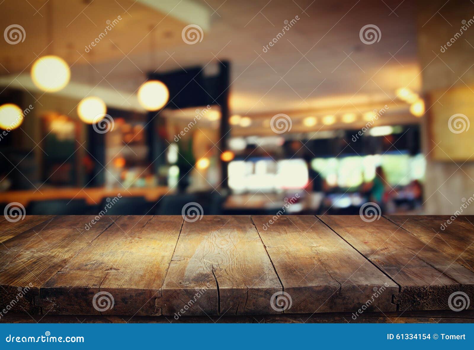 Image Of Wooden Table In Front Of Abstract Blurred Background Of Restaurant  Lights Stock Photo 61334154 - Megapixl