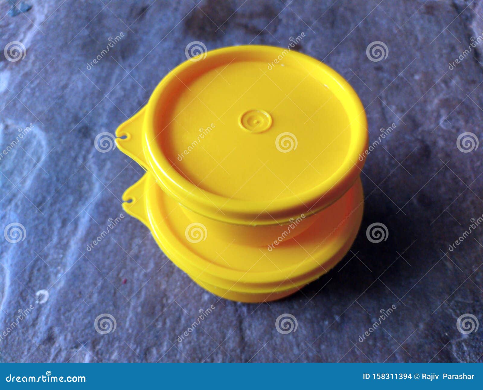 Yellow Plastic Container Box on Stone Background Stock Photo Image of