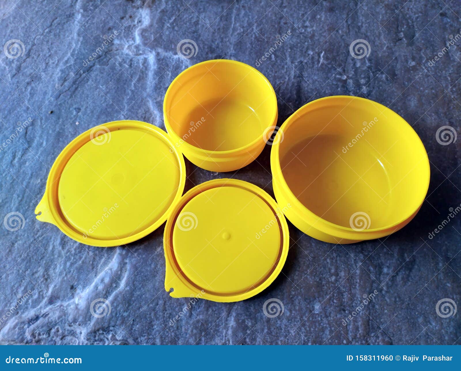 Yellow Plastic Container Box on Stone Background Stock Photo Image of