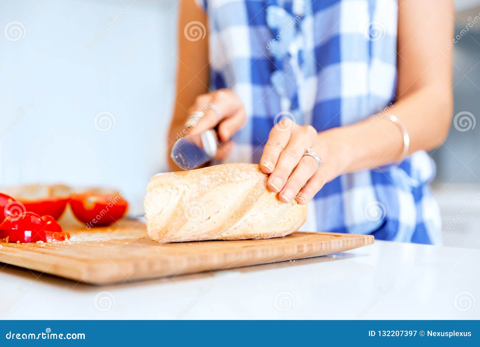 Woman hands cutting bread stock image. Image of home 132207397