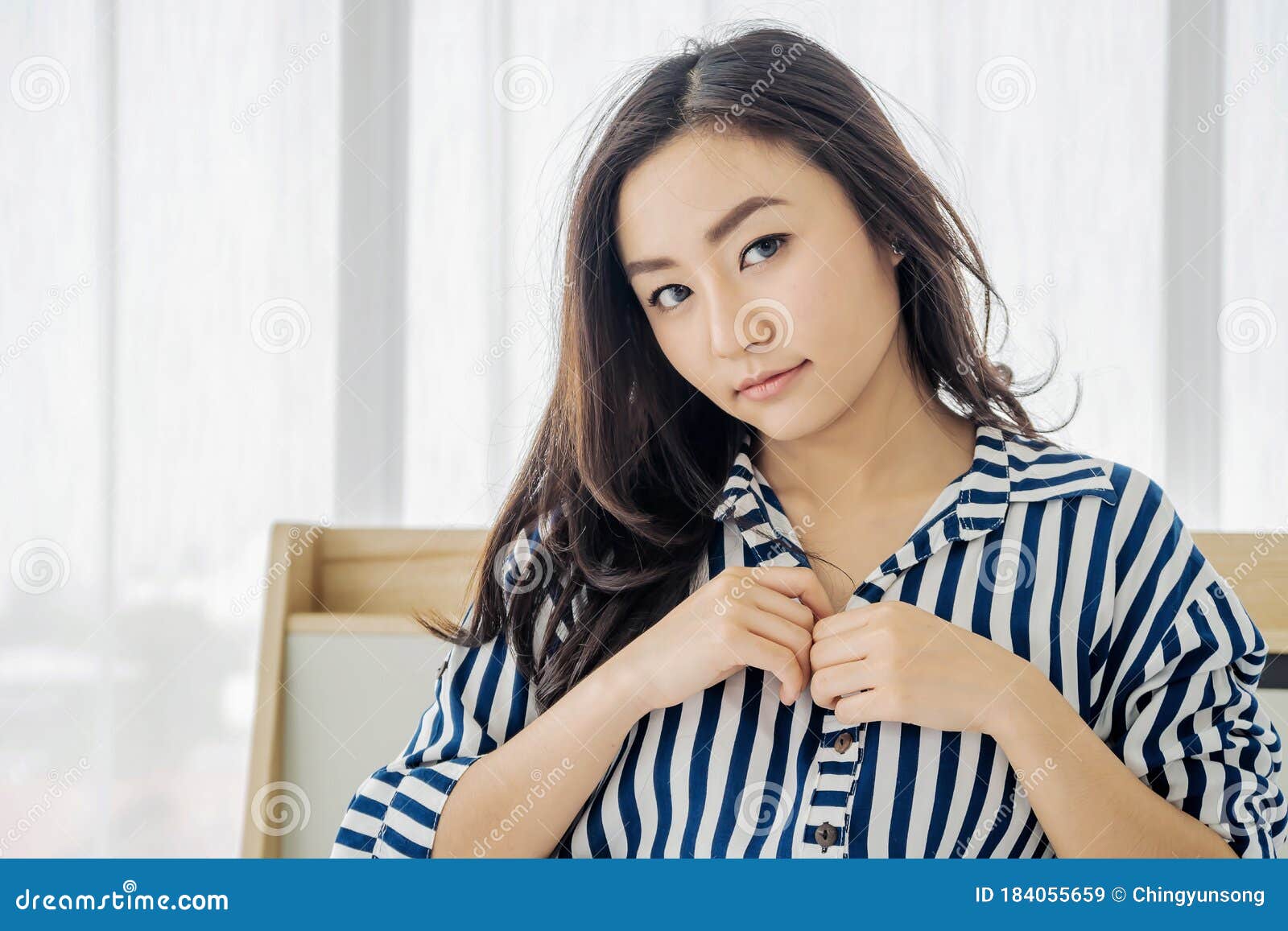 Images of Young Asian Woman Going To Take Off Shirts by Beginning To Remove the Buttons To Begin Pleasure, Sex Concept Stock Image
