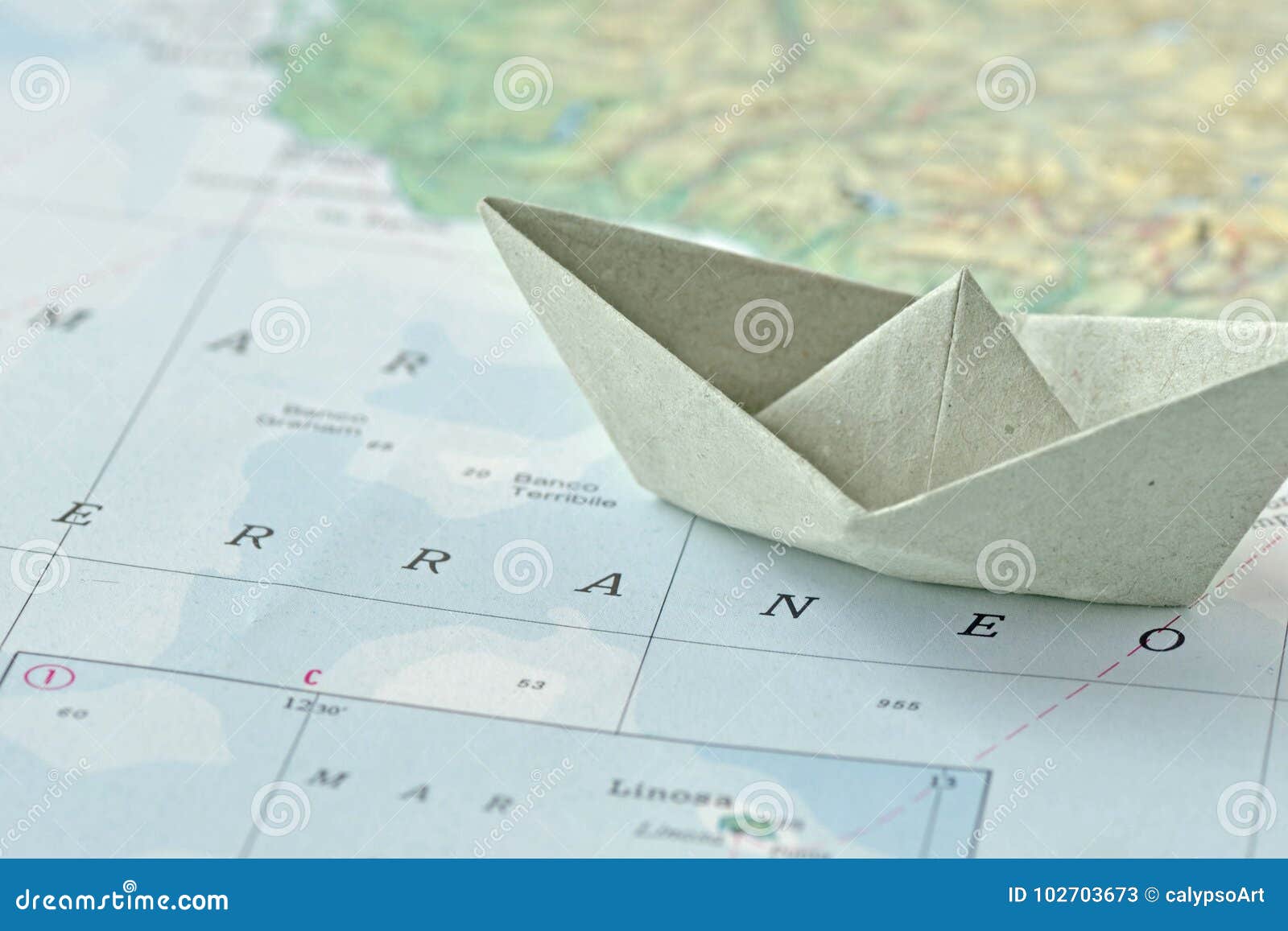 immigration and ask for asylum concept - paper boat on map
