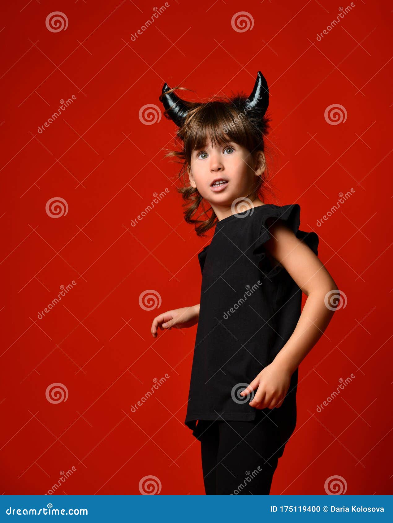 Imp Girl Having Fun on a Red Background Stock Photo - Image of disguise ...