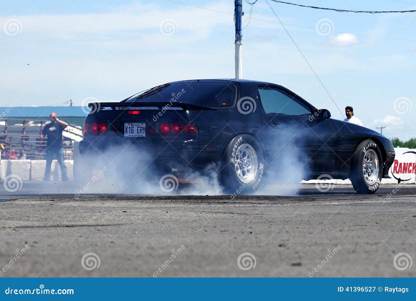 Drag racing. Napierville dragway, canada - june 7, 2014 rear side view of import car during burnout at head up challenge event.