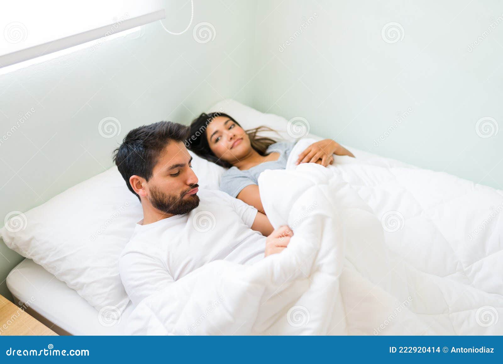Sad Husband with Problems in the Bedroom Stock Photo