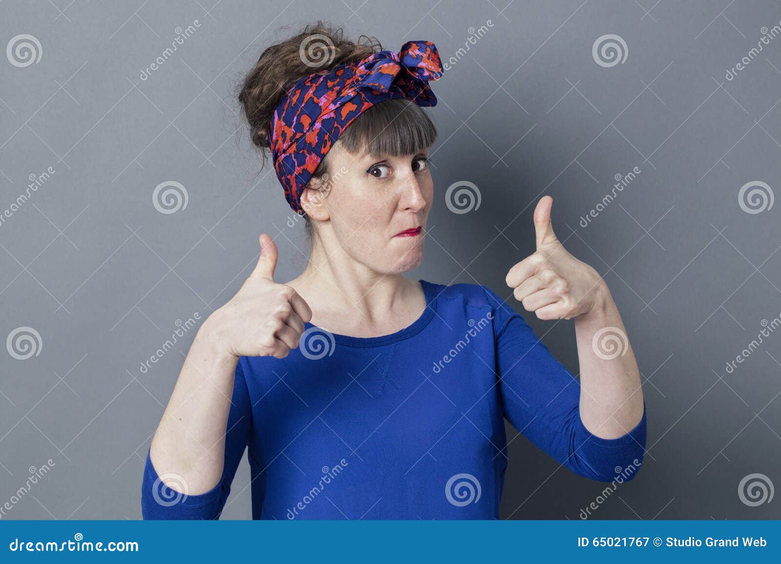 impressed woman with thumbs up for cool happiness