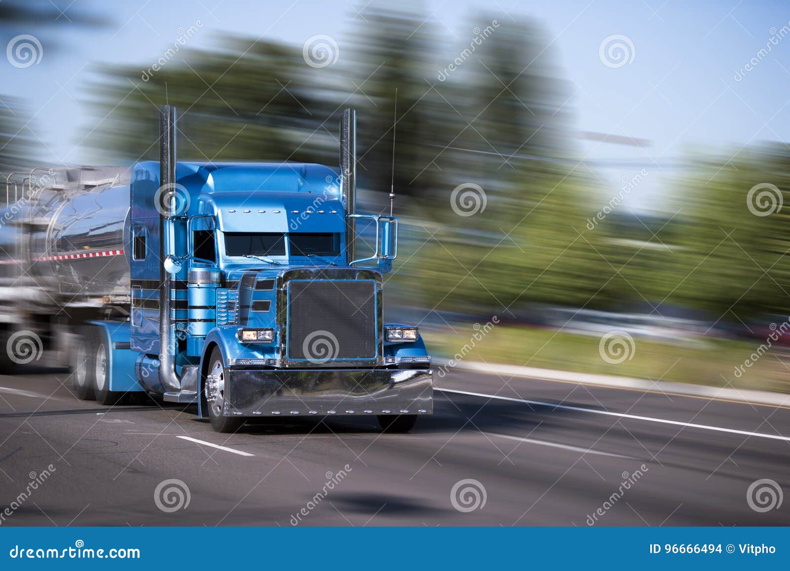 impressive customized blue big rig semi truck with tank trailers