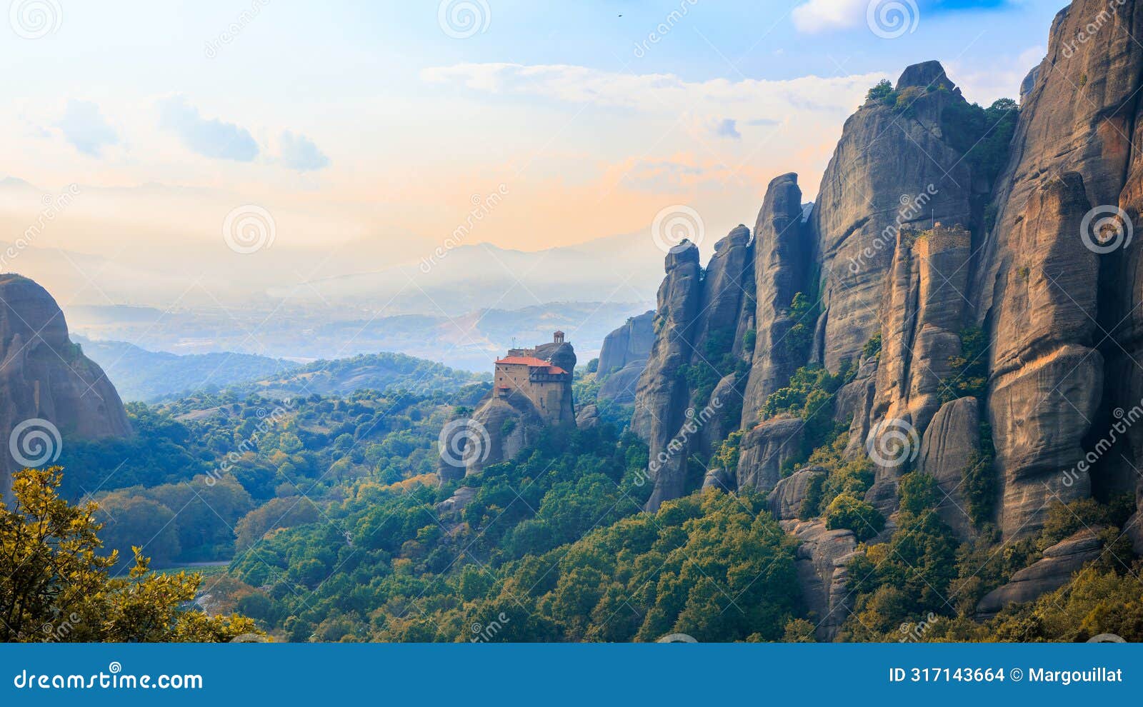 impressive landscape of sandstone, rock formation and monastery at sunset