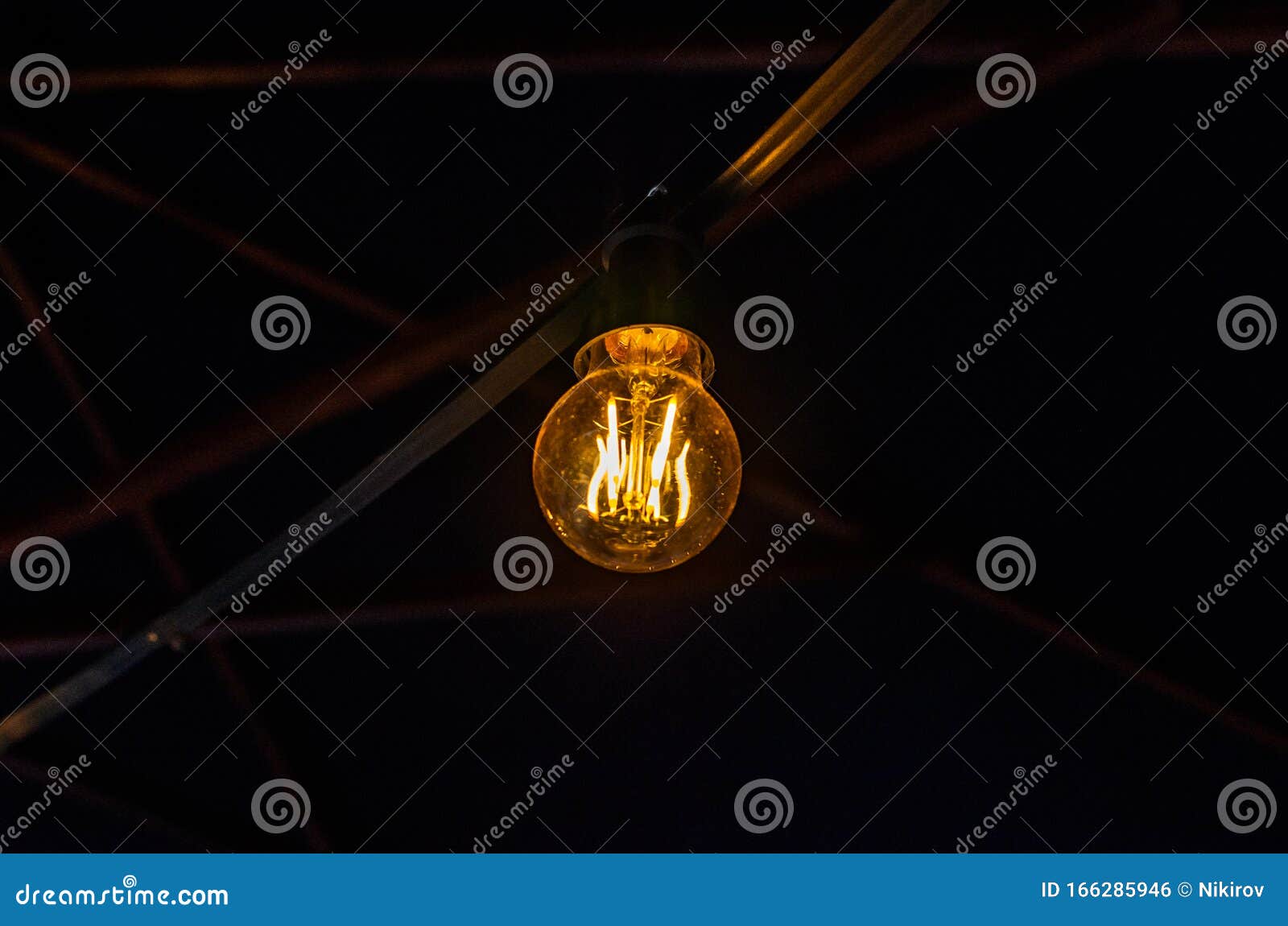 Incandescent Light Bulb Illuminates the Dark Stock Photo Image of