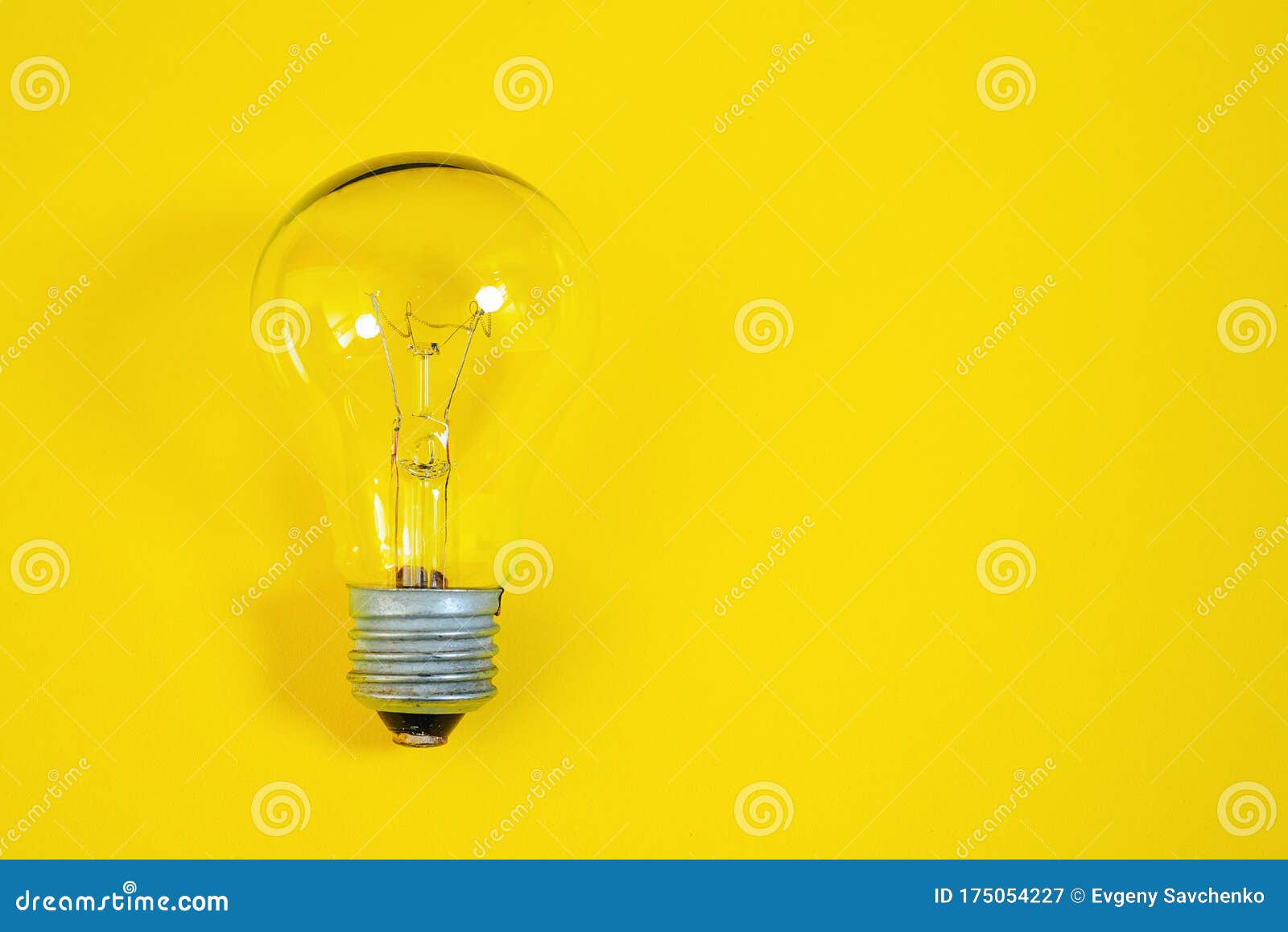 Incandescent Light Bulb on a Yellow Background Stock Image Image of