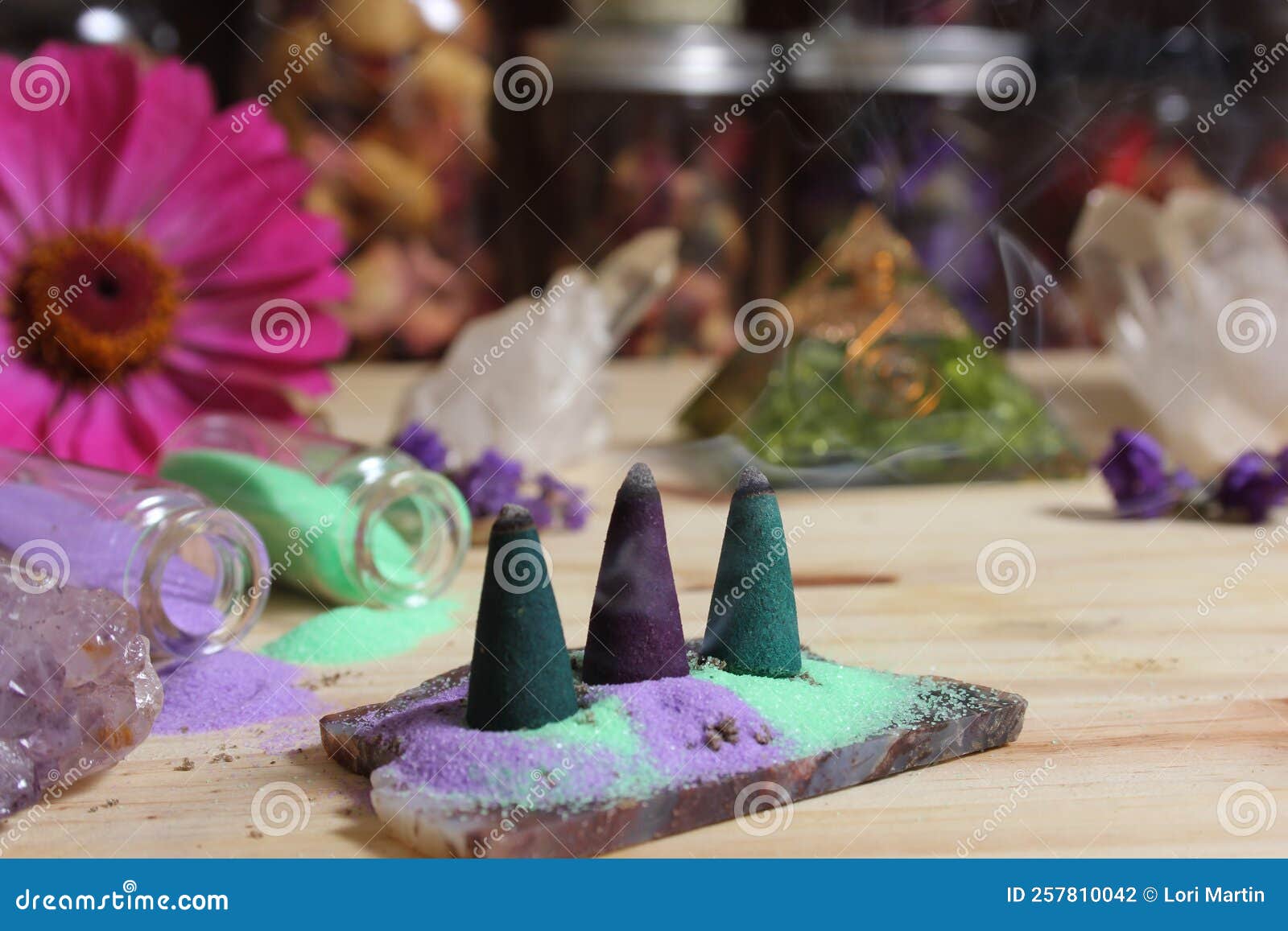 Incense Cones on Stone Slab with Crystals and Flowers Stock Photo