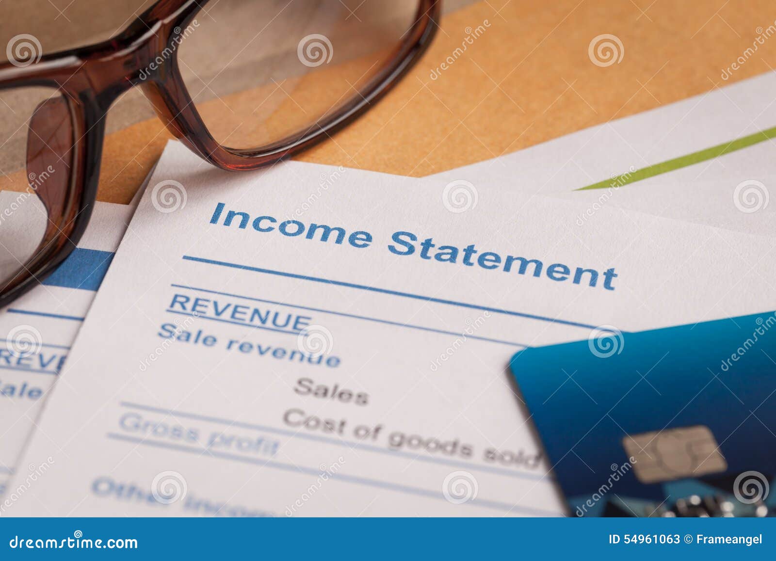 income statement letter on brown envelope and eyeglass, business