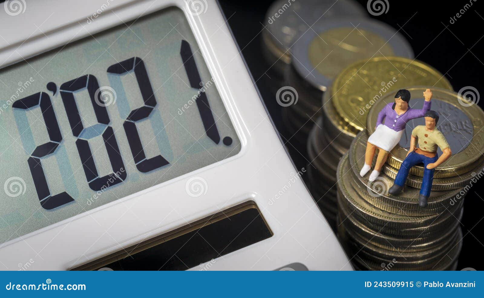 income tax campaign 2021 spain. young couple sitting on coin stack. declaracion de la renta. macro
