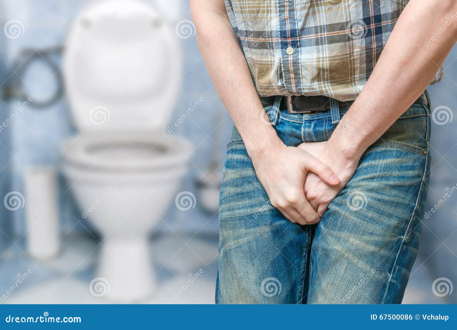 incontinence concept. man wants to pee and is holding his bladder