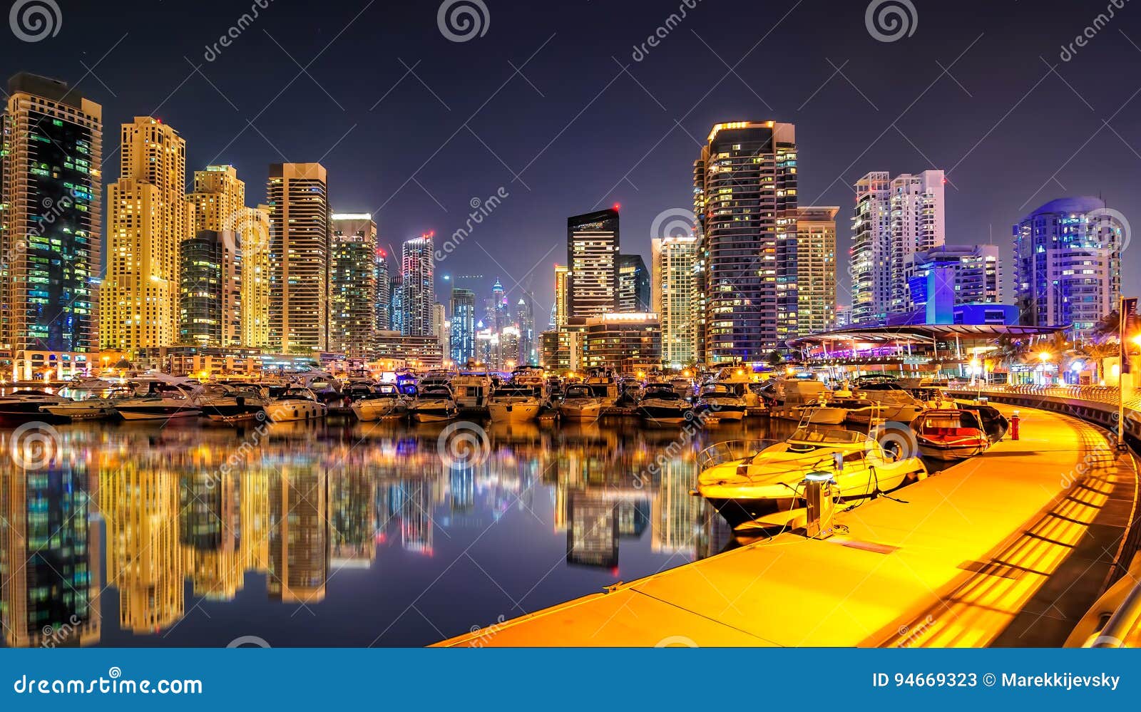 incredible night dubai marina skyline. luxury yacht dock. dubai, united arab emirates.