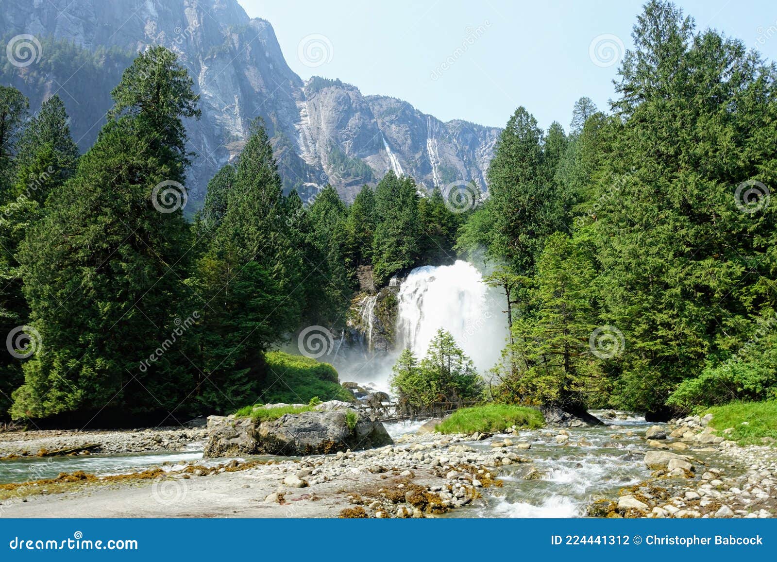 an incredible view of princess louisa inlet and chatterbox falls, with a huge waterfall and giant cliffs in the background