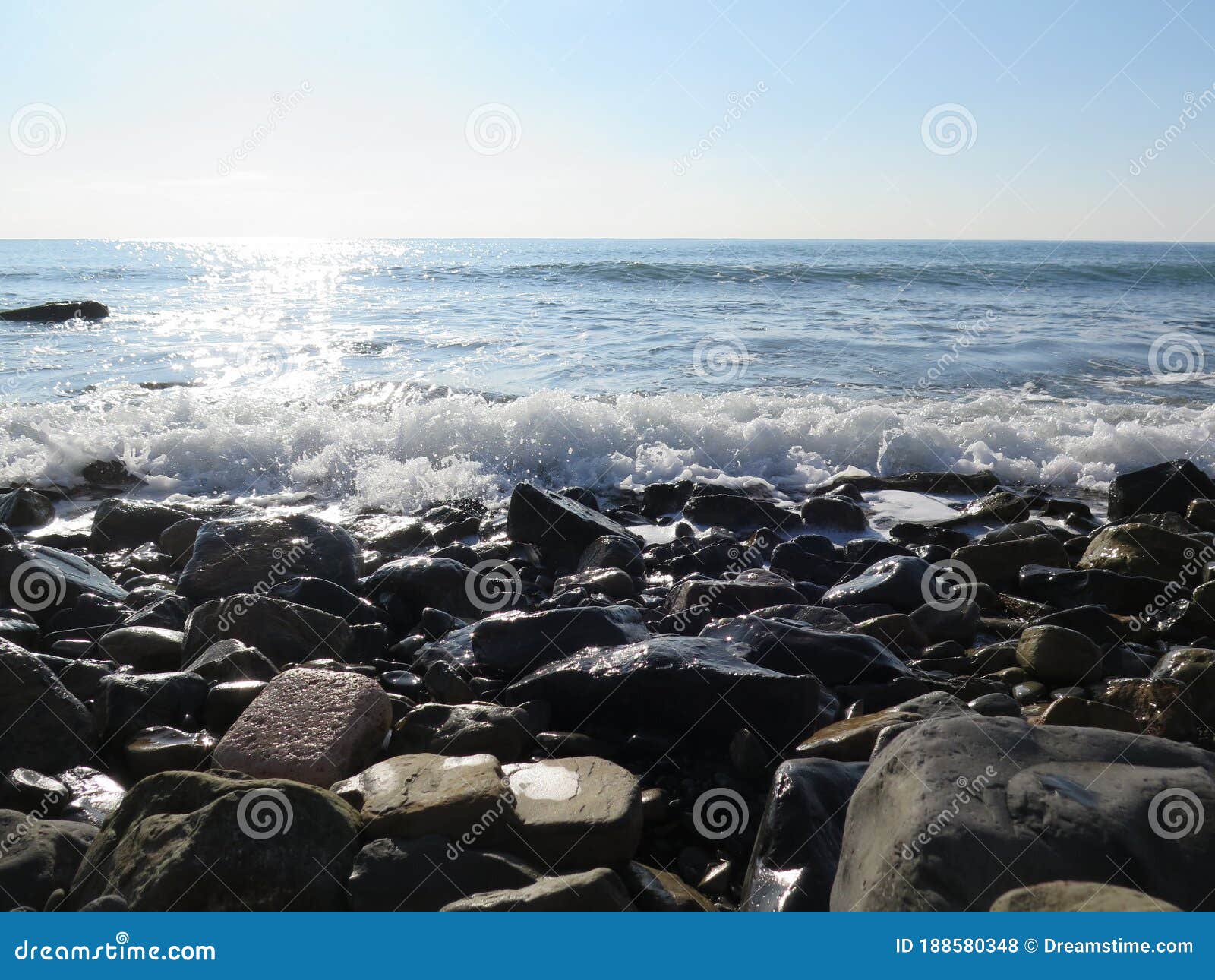 Waves crashing on rocks stock photo. Image of water - 188580348