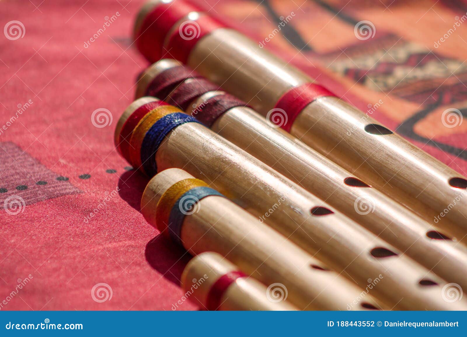 India,Hindu Bamboo Flute Called Bansuri on a Red Table. Stock Photo