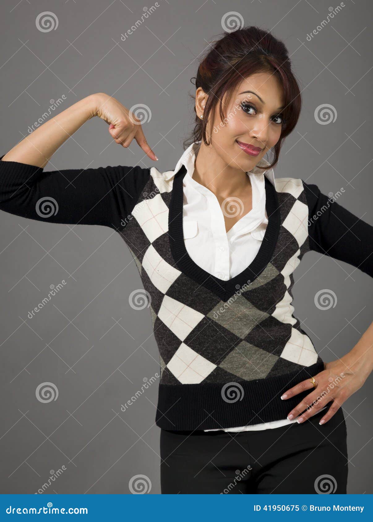 Indian businesswoman pointing at herself isolated over colored background. Adult indian woman in studio isolated on grey background