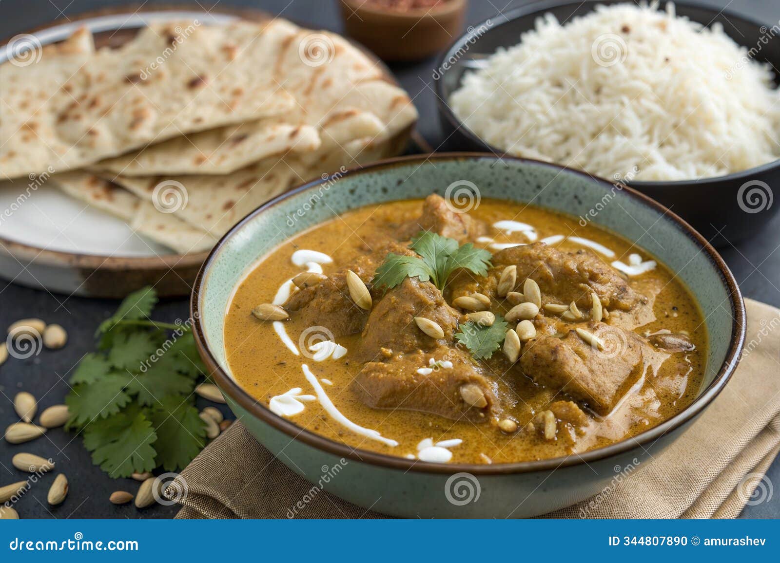 indian chicken korma with basmati rice close-up on the table.