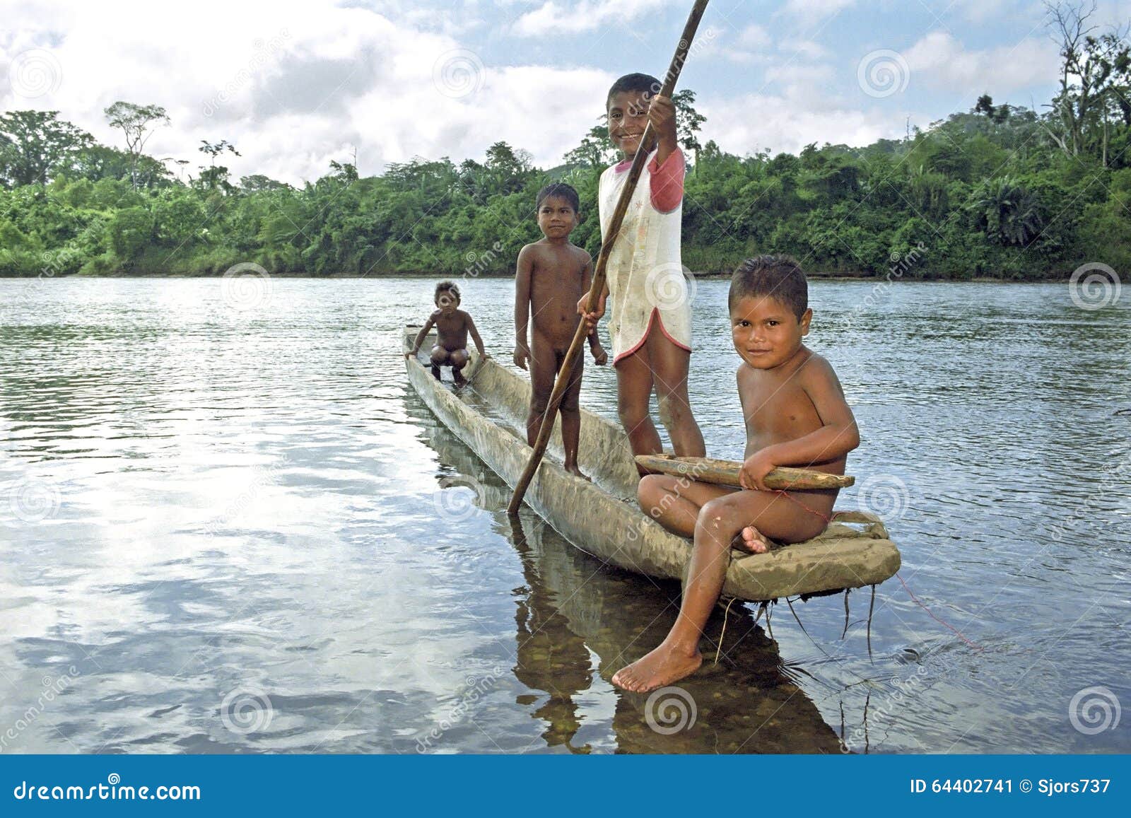 boaters discover a very old dugout canoe near a river in