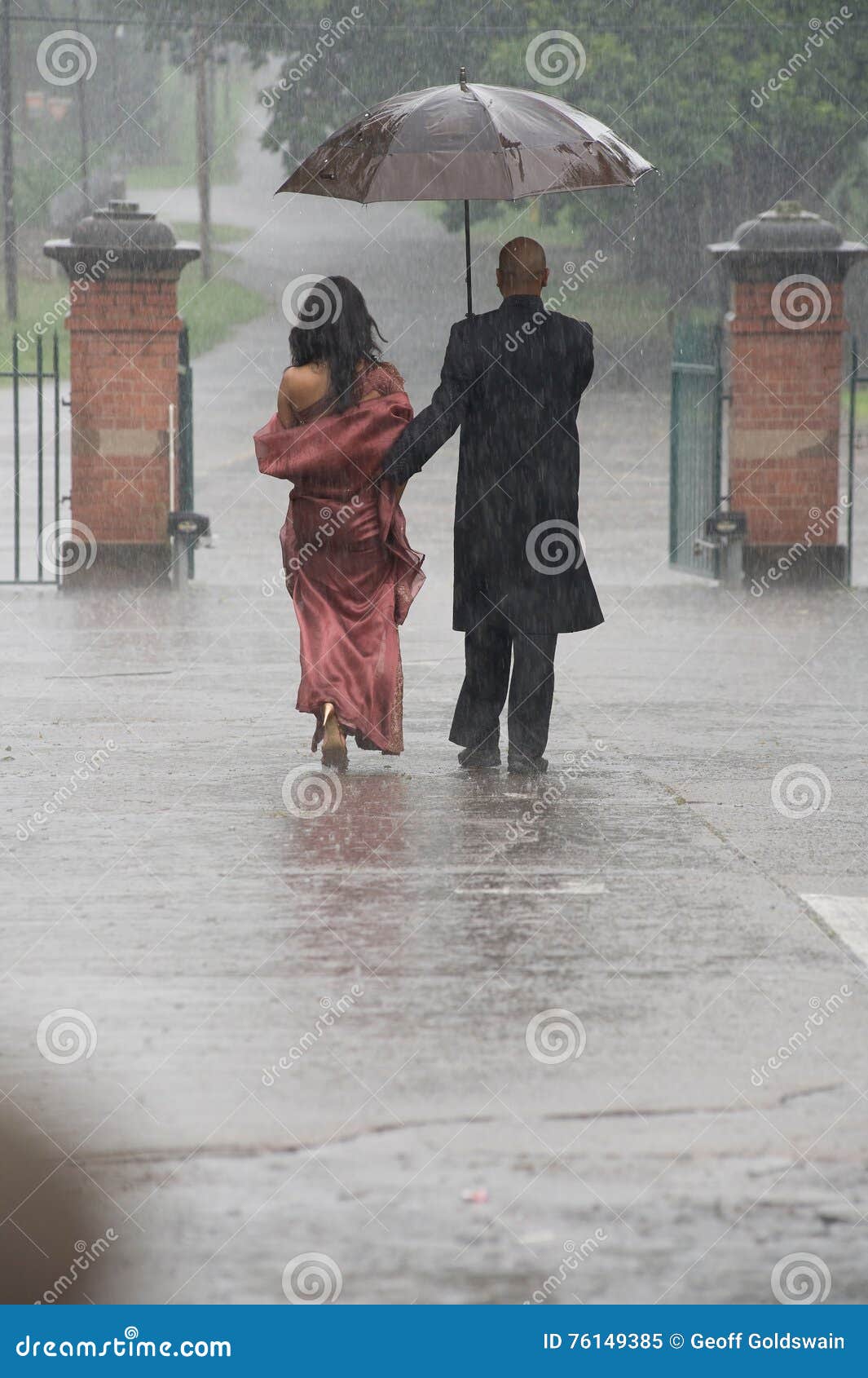 Indian Couple Holding an Umbrella in the Rain. Stock Image Image of girlfriend, indian 76149385