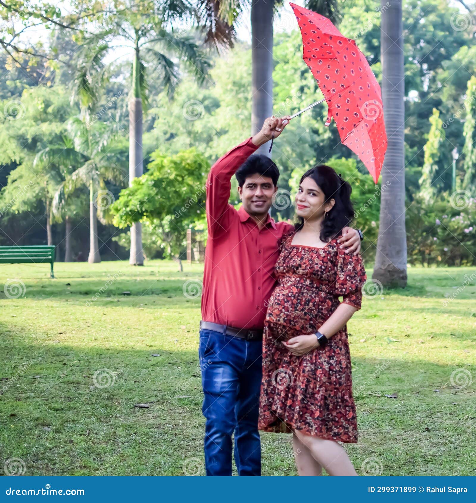 Indian couple posing for Maternity shoot pose for welcoming new born baby  in Lodhi Road in Delhi India, Maternity photo shoot done by parents for  welcoming their child, Pre Baby Photo Shoot