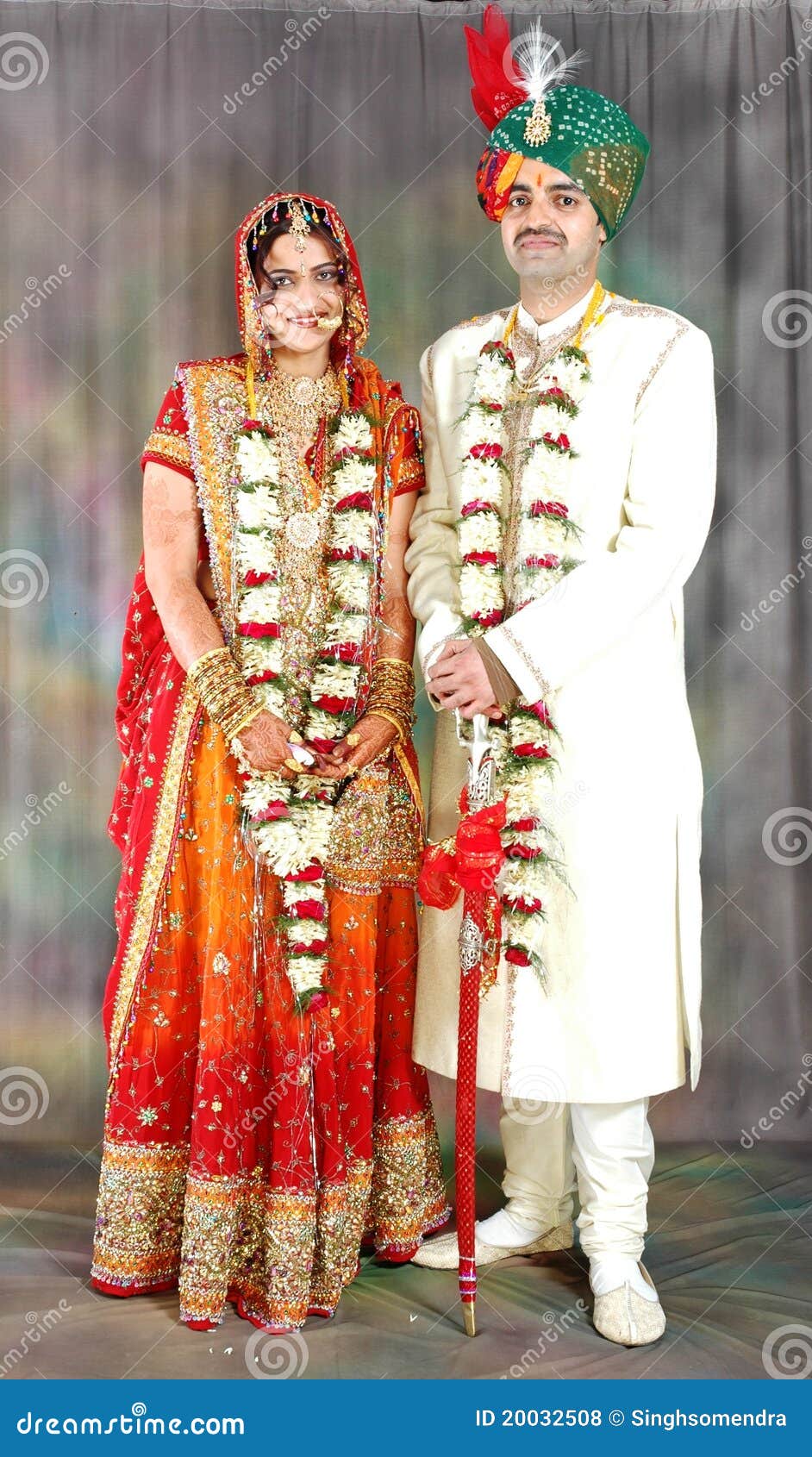 Classic Couple Wearing Elegant Wedding Dress and Dark Green Jacket