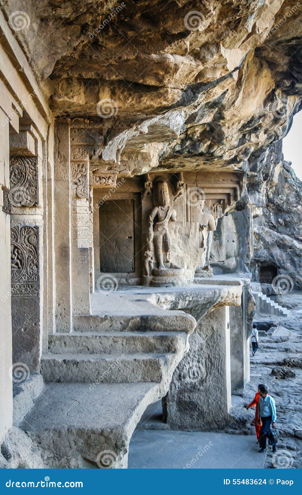 Indian couple visiting Ellora caves. Indian couple visiting Jain temple carved out of a giant solid rock in Ellora, India