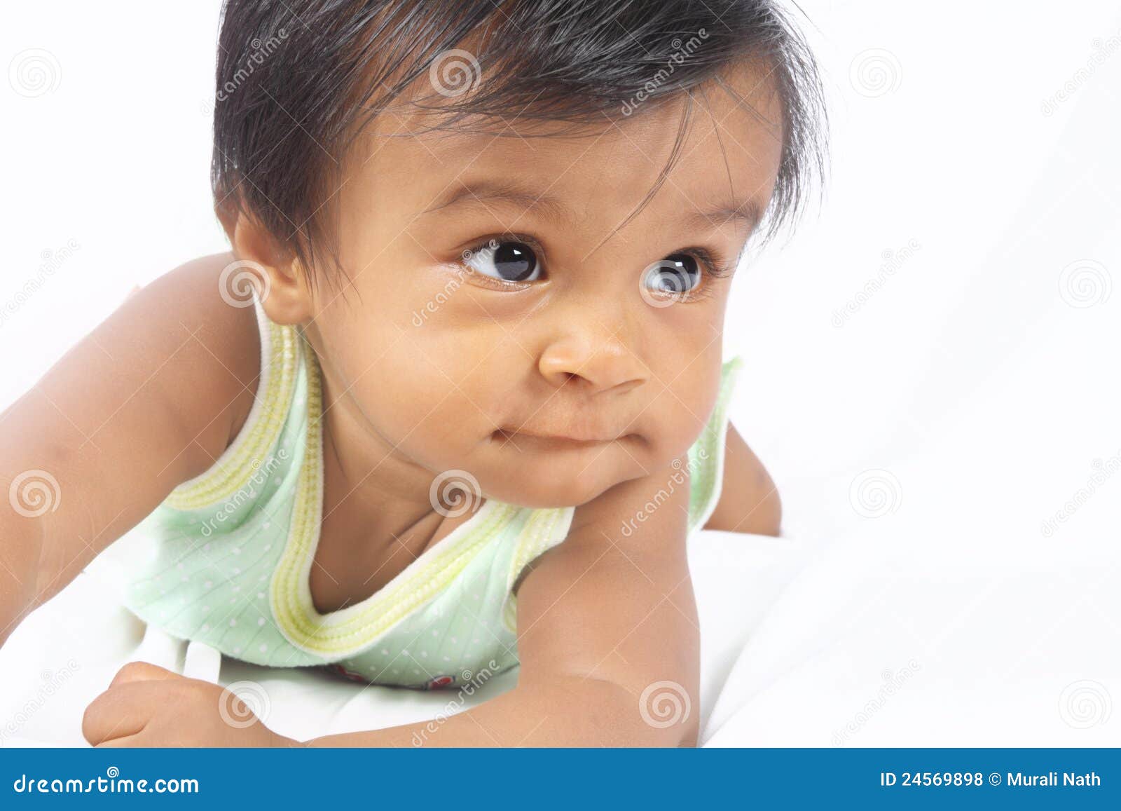 Indian Cute Baby Lying On Bed Stock Photo - Image of ...